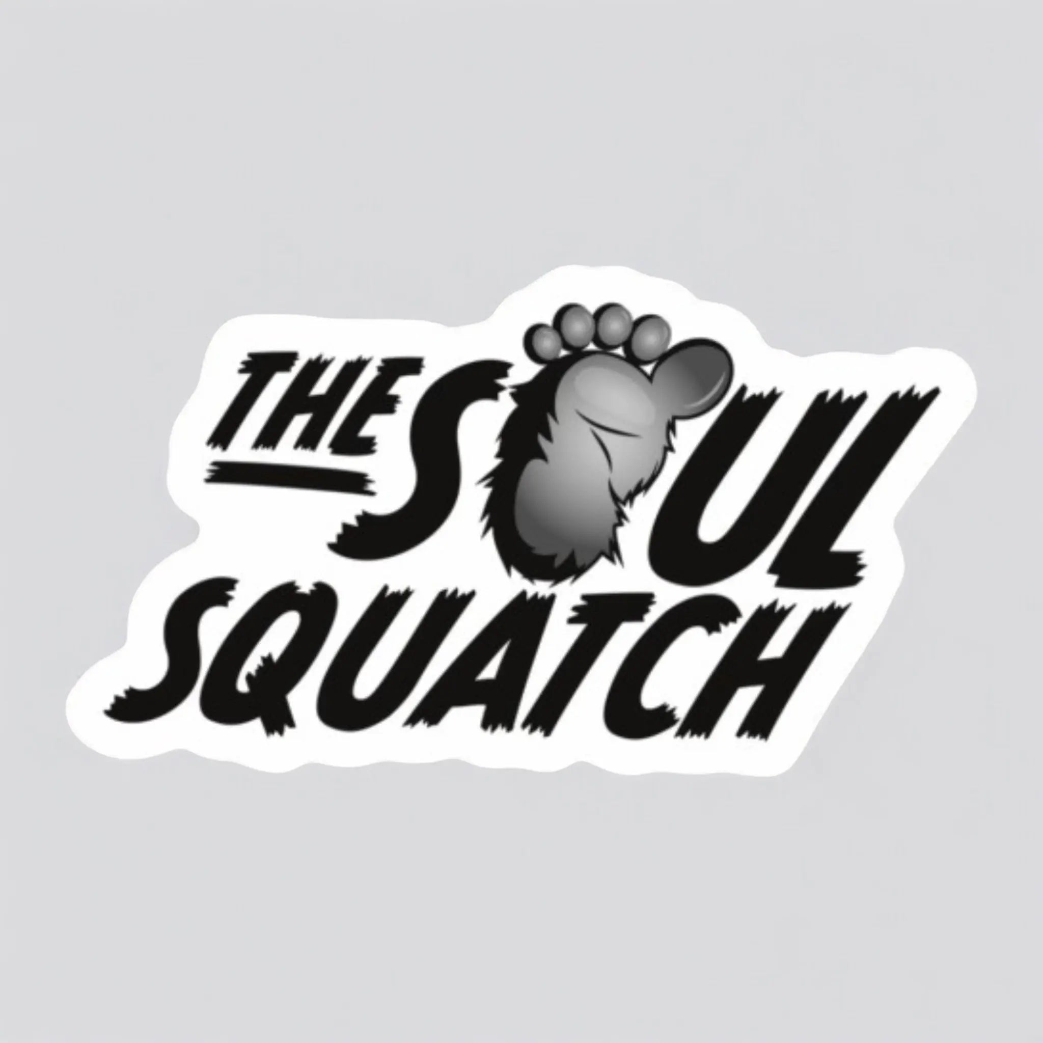 Flat lay of The Soul Squatch logo sticker — 3x1.69” waterproof, scratch-resistant vinyl sticker featuring a bold Sasquatch footprint design.
