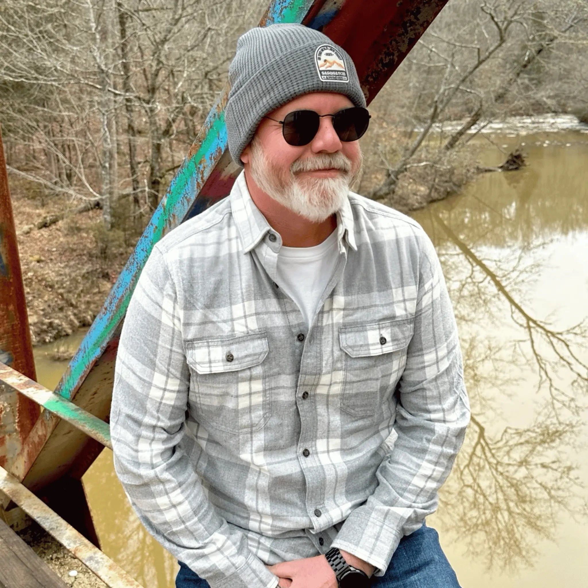 Man wearing the Mountain Peak Gray Sunrise Summit Beanie — soft knit gray beanie with patch, ideal for outdoor explorers and everyday wear.